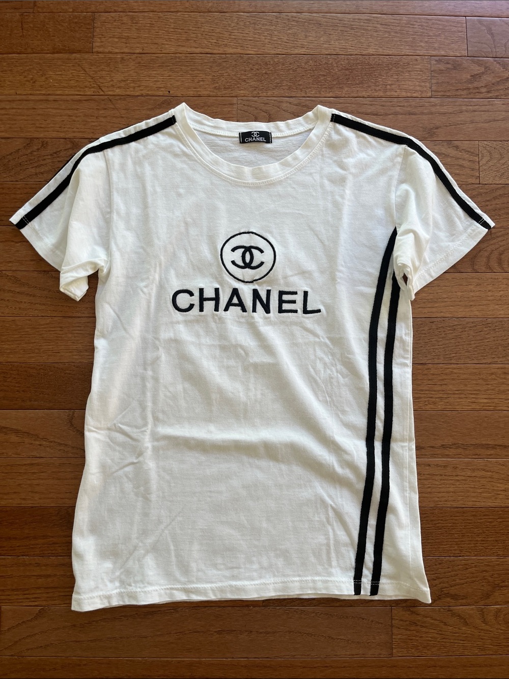 Inspired by CHANEL White Tee with Black Logo & Stripe Details